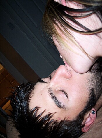 A f*cking hot couple lockin' lips, tongues out and everything.
