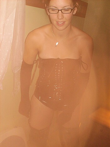 "Holy fucking tits! Look at that hot slut's titties poking out of her leather corset and boots! She's one sexy bitch!"