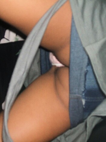 Here's a goddamn close-up of some fucking ass crack with a ripped-ass thong, ya dumb fucker.