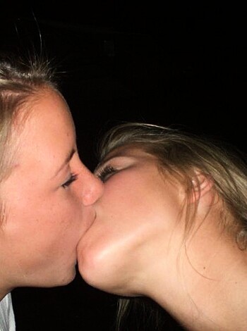 Vulgar description:

This picture is fucking hot! It shows two horny chicks sucking face and swapping spit in a sloppy, passionate make-out session. You can see the wetness on their lips and tongues, as they hungrily explore each other's mouths. Fuck yeah, bi ladies!