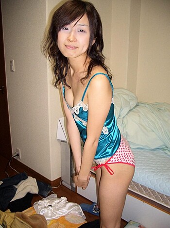 "Watch this slutty Asian chick in her sexy panties taking dirty selfies in her fuckin' bedroom, complete with trash cans and laundry."