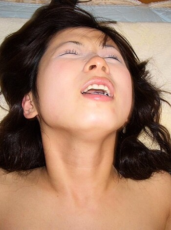 Here's a fucking image of a bitch on some goddamn massage table, naked as fuck with her dumb tits hanging out and her pussy gaping open like it's trying to suck dick or something.