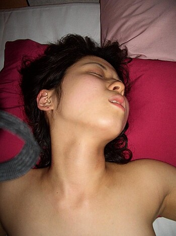 "Here's a fuckin' pic of some hot-ass bitch layin' nude on her mattress, with her tits and pussy fully exposed."