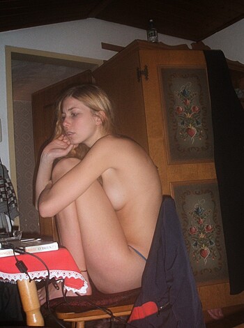 Look at that fucking bitch sitting on that goddamn chair with her fucking legs crossed like she's some kind of hot piece of ass.
