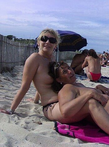 "Here's a picture of two chicks tittyfuckin' on the sand."