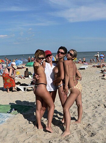 Vulgar Description: "A fucking hot ass bunch of naked chicks lounging around and tanning their milky white boobies on the goddamn beach while getting all dolled up for some serious cocksucking."