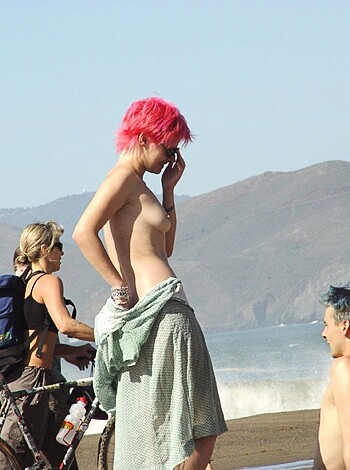 "Here's a hot chick in her birthday suit, sunbathing with some dude on the shore. Lucky bastard."