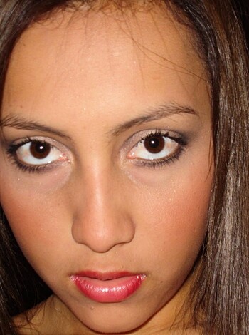 "This image depicts a bitch with heavy makeup, including a cherry-red fucking lipstick. Bitch's dressed in some frumpy shit, but she ain't showing off no pussy or tits. You know, basic fashion choices."