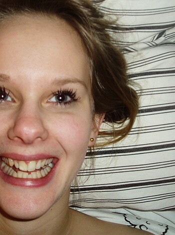 Lying ass fucking naked bitch covered in makeup on a goddamn bed.

```