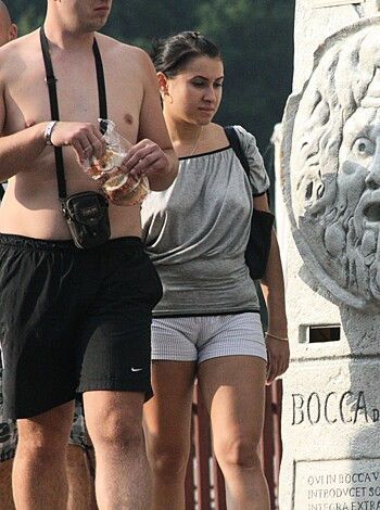 """
Here's a dick-eating motherfucker munching on some fuckin' bread while strolling through the goddamn town, passing right by a marble cunt-licker and asshole-flasher statue. 
"""