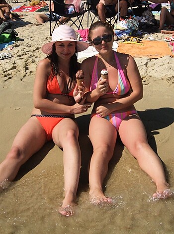 "F**k me running! Two sluts on the sandy shore, sucking on a popsicle while showing their tits!"