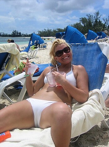 """
A fat, tanned whore in a skimpy bathing suit chugging down some fruity alcoholic beverage while lounging on a plastic lawn chair on the sandy shore of some godforsaken beach.
"""