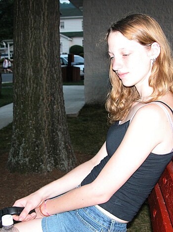 """
Hey, check out this picture of some f*ckin' hot b*tch sittin' on her ass outside some sh*tty ass building. F*ck know where she lives or why she's just chillin' on the damn bench like a loser, but I can tell you one thing - that ass looks good enough to eat! 
"""