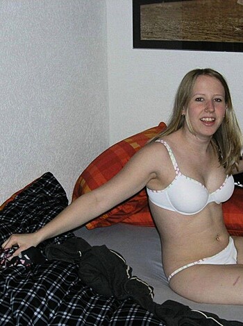 Here's an image of some slutty whore straddling her douchey sheets, wearing a matching panty-bra set like she ain't got shit else to wear and hoping some fuckhead with a camera will give her a taste.