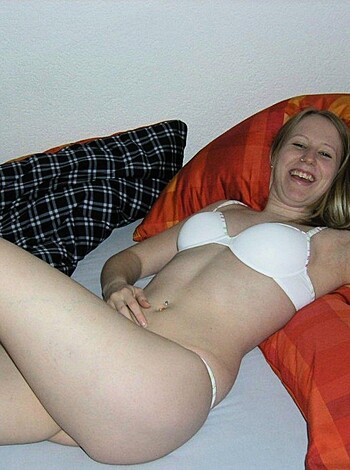"""
Look at this bitch! She's got no fucking shirt on, and she's all laid out on a bed or something with her big fake tits staring right at you, and she's got that stupid smirk on her face like she thinks she's hot shit. Who the hell takes a picture like this? Fuckin pervs.
"""