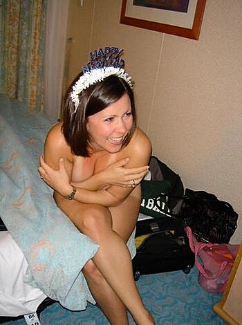 Here's a shot of some hot bitch, with birthday hat and nipple rings gettin' fuckin' naked on her bed.