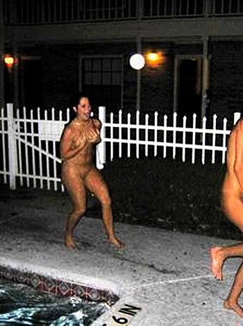 Here's a fuckin' snapshot of some dickhead with his shirt off, chillin' by the pool with a bitch in tight denim cutoffs.