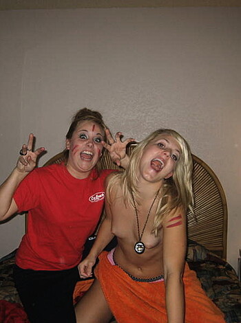 A couple of bitches sporting ridiculous facial expressions while one of them has an intricate tat on her scrawny bicep.