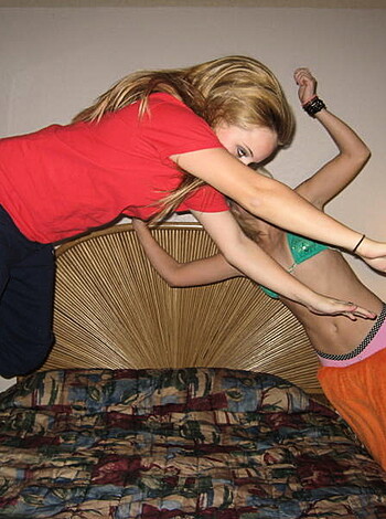 """
Check out these two dykes getting their asses off in a room while dressed like a fucking rainbow. One of them is even leaping around on a goddamn mattress, for Christ's sake!
"""