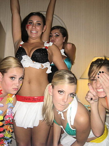 Topless blonde babe dances in front of two brunettes dressed in lacy underwear, exposing their breasts and asses as they party the night away.