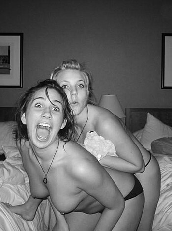 "Here's a fucking picture of two hot chicks riding their motherfucking bikes in their barely-there bikinis. Oh, and the one on the bike is actually riding it while wearing her bikini bottom. Sucks to be you, dickhead who took this photo."