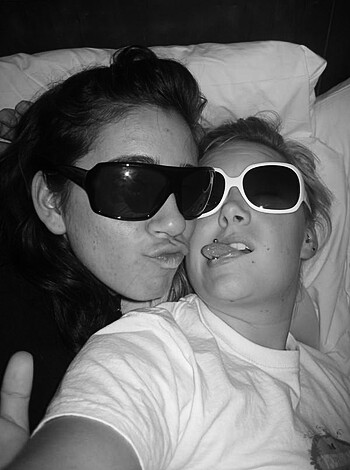 Look at these two bitches fuckin' suckin' each other's face, one with shades on like she's cool as hell.