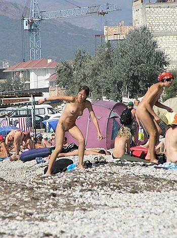 "Dick-swingin', naked assholes baskin' in the sand and showin' off their cocks on a seaside resort."