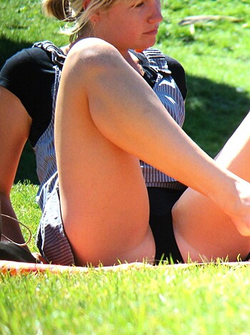 Here's the shitty description of that picture: A smoking hot babe with her legs wide open, giving you a clear view of her smooth thighs and sexy feet. Fucking awesome!