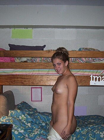 "Here's a slutty bitch wearing panties posing by a fuckin' bed."