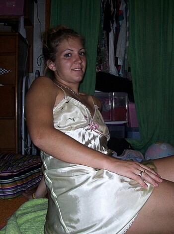 A fucking hot chick is lying on her ass wearing a sexy-assed sleepwear while enjoying a lazy day at home.