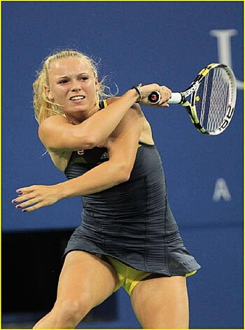 Here's a f*cking hot babe showcasing her bouncing tits and ass while smashin' the shit outta that ball!
