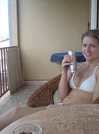 A fucking hot chick in a bikini sucking down a goddamn beer.