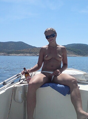 "Thick-thighed slut straddles dinghy with no shirt."