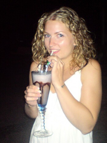 Here's an image of a hot babe sucking on a fuckin' strawberry milkshake like a pro.