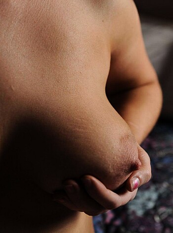 "Here's an image of a bitch's naked titties, she's got one hand on her rack, fuckin' perfection."