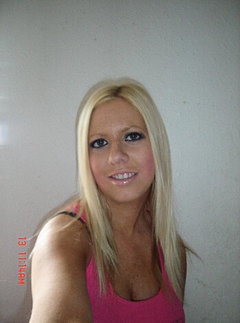 Vulgar description: "Check out this hot blonde bitch in a tight pink t-shirt."