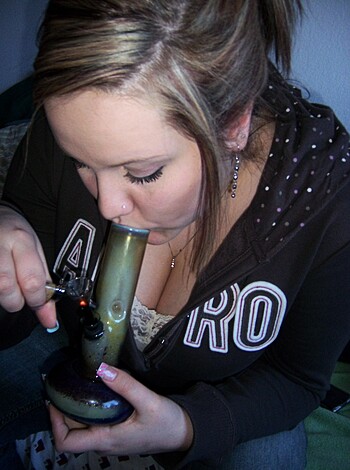 "Look at this bitch, blowing smoke from her weed pipe."