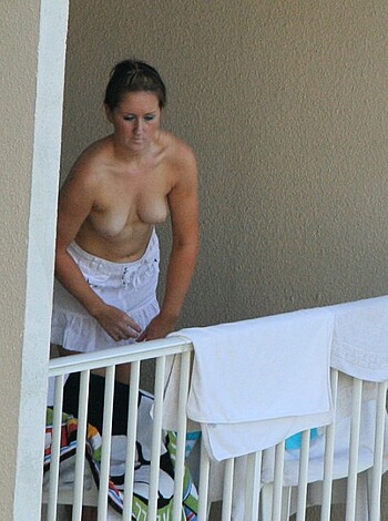 "Close-up image of a woman's tits with no bra."