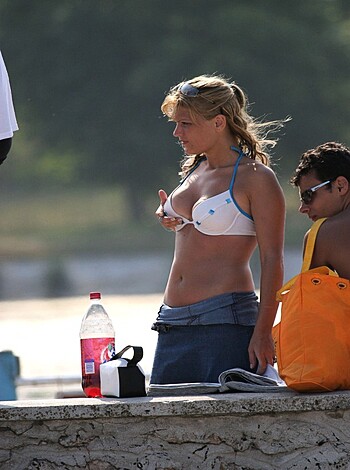 "Here's a picture of a hot chick in a skimpy swimsuit, get a load of those titties and ass."