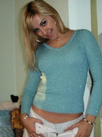 "Check out this hot chick in her tight blue tee and panties."