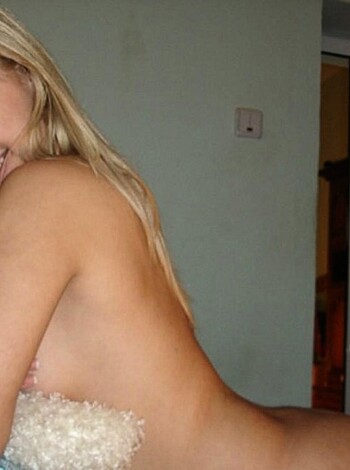 A nude chick with a teddy bear.
