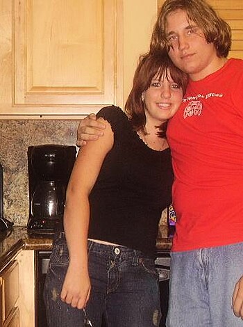 "Busty blonde chick and her douchey dude boyfriend faking smiles while cookin' up some greasy grub, hoping to snag a few likes on the gram."