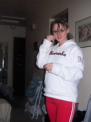 Vulgar description: "Look at this slutty cunt holding a fucking bottle of booze while posing in some dumbass's living room like she owns the place."