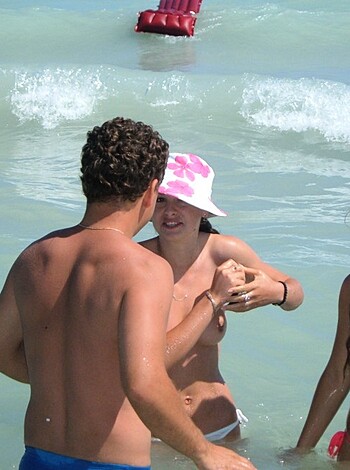 Nice topless on the beach - Photo 18
