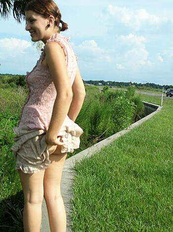Image of a slutty bitch in a fuckin' hot pink dress.