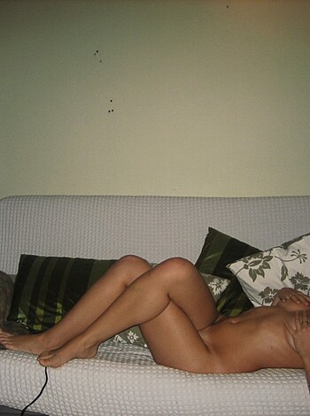 Here's a pic of some bitch chillin' on her sofa with no fuckin' clothes on.