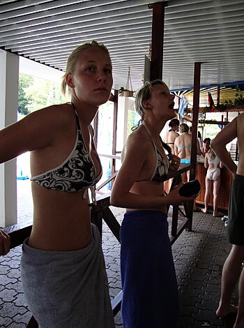 A fucking shower with a blue tarp over it, and two hot chicks wearing bikinis, standing ass-to-ass, like they’re waiting for someone to fuck their tight holes.