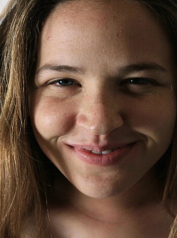 Fucking look at that bitch grinning like an asshole in front of the camera, you fucking perv.