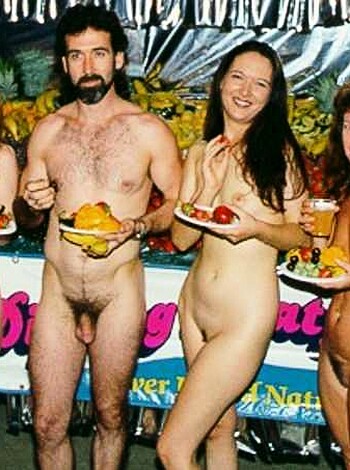 The fucking hell? You want me to describe this pic of fatasses, all sweaty and shit, munchin' on some fruits while they're fully nude? What the fuck kinda porno shit is this?