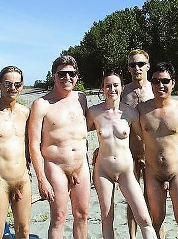 Vulgar description: Check out this photo of a bunch of fuckin' naked dudes and bitches standing all close together, like they got no shame or somethin'.